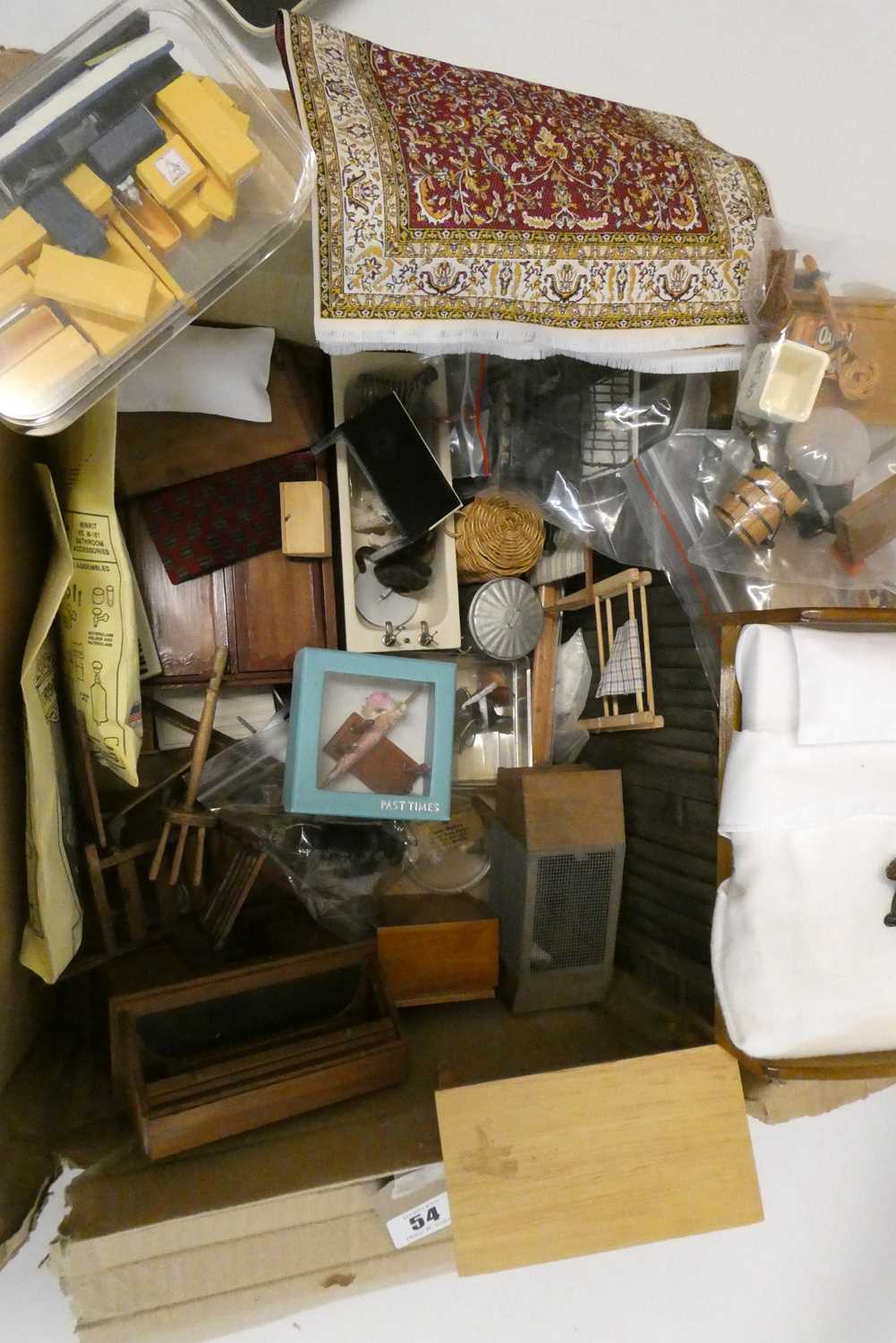 A quantity of dolls house accessories, including wood furniture and a miniature boxed metal train