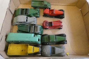 Ten unboxed early Dinky vehicles including saloon cars, bus and trucks items, in fair condition