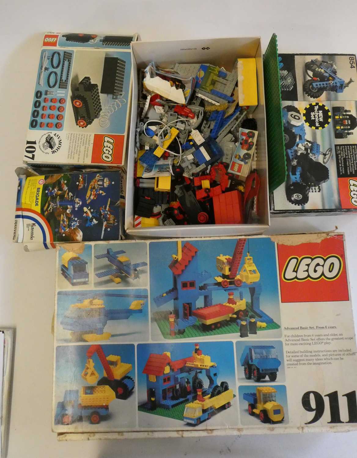 A box of vintage Lego, including sets 854, 107, 911 and other loose parts, completeness unchecked,