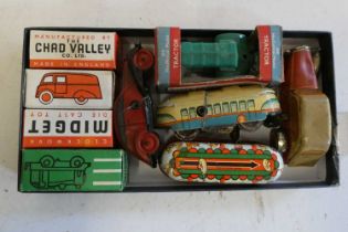 Eight small clockwork vehicles by Chad Valley and others including vans, buses and tractor,some