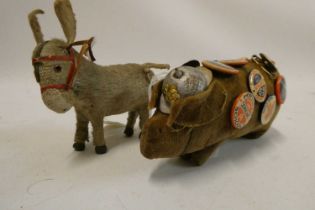 A 5 1/2" felt boar wearing a WWI style french helmet and covered in 16 badges including Portland