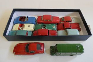 Ten unboxed Dinky vehicles including saloon cars, race cars, and modern issue EFE Bus, models in