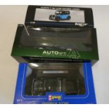 Three 1/18th scale diecast cars comprising Ricko Austin 7 saloon, Auto Art Jaguar D Type, Revell MGA