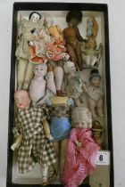 Collection of miniature dolls, including an all bisque nippon doll, a Victorian china head doll