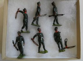 Britains Gurkha rifles figures comprising six soldiers with swinging arms and rifles, one item has