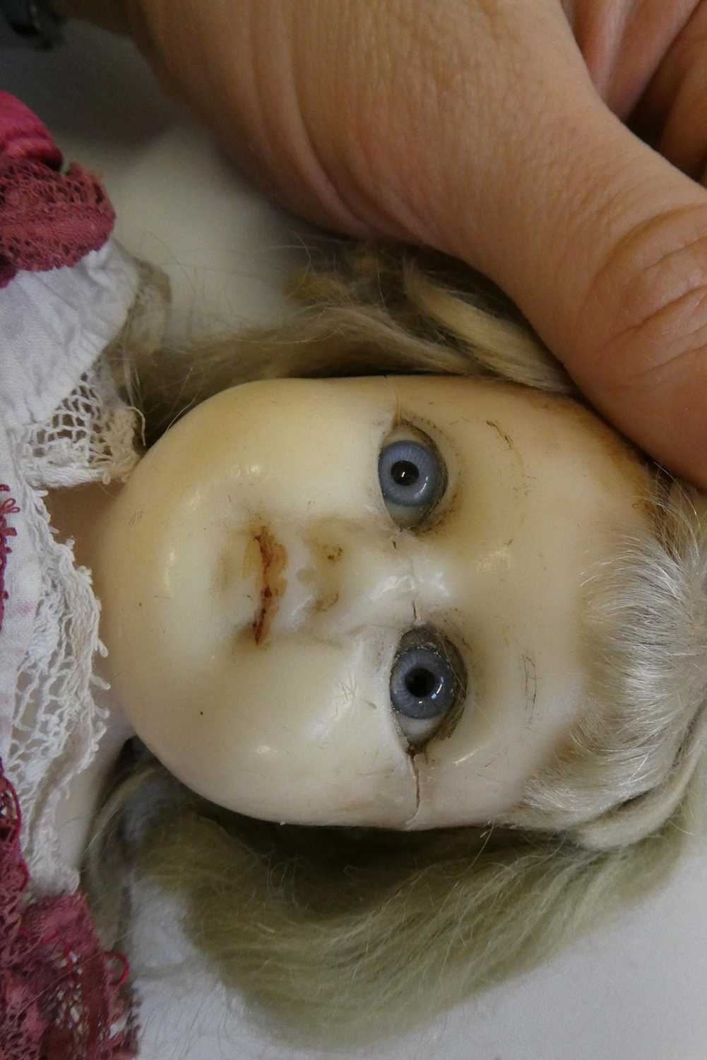 A Victorian wax shoulder head doll, with blue glass eyes, blond hair, closed mouth, kid body and - Image 2 of 5