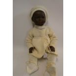 An Armand Marseille bisque socket head baby doll, with brown glass sleeping eyes, closed mouth,