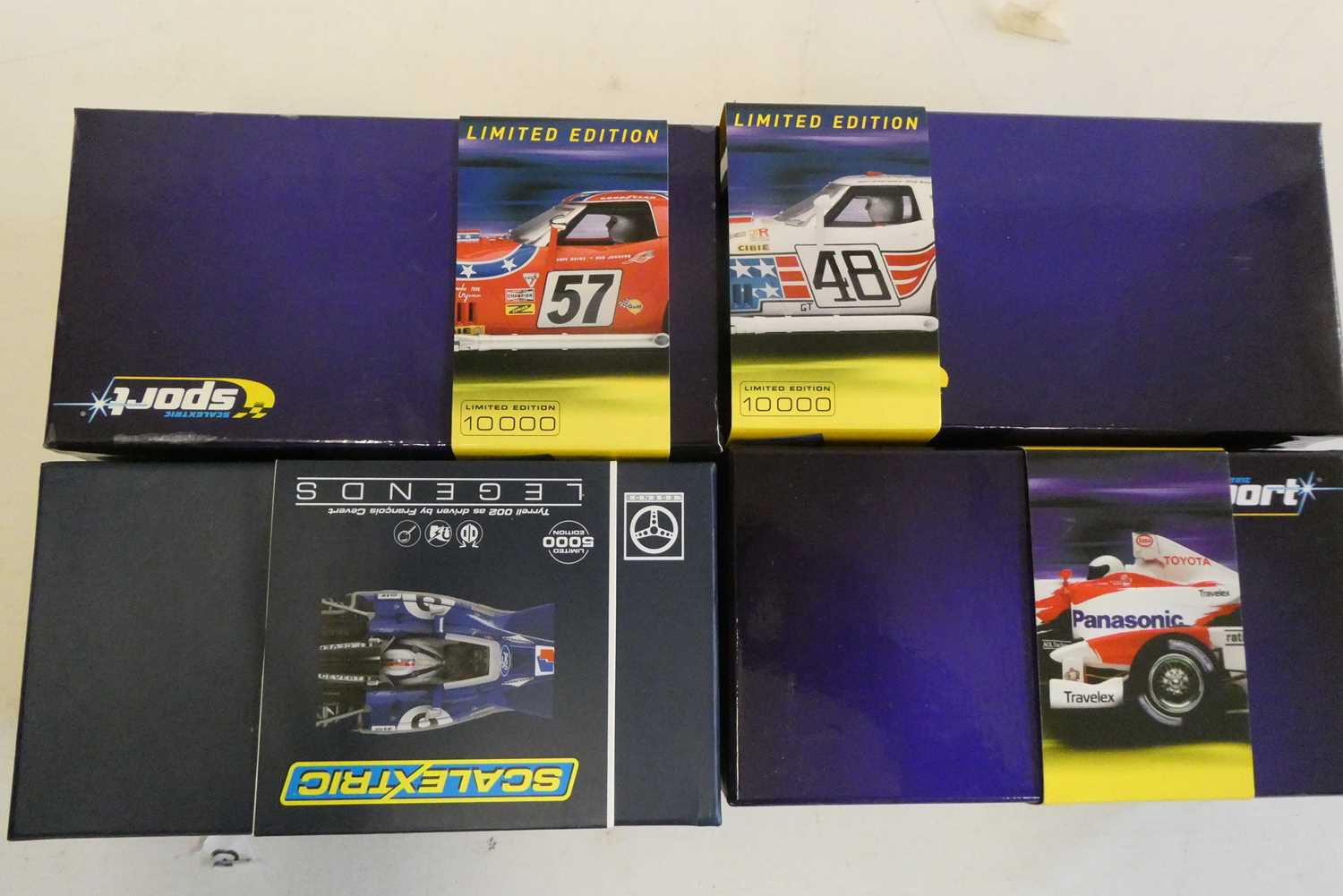 Four Scalextric cars comprising two Chevrolet Corvettes, Toyota TF102 and Terrell F1 car, all