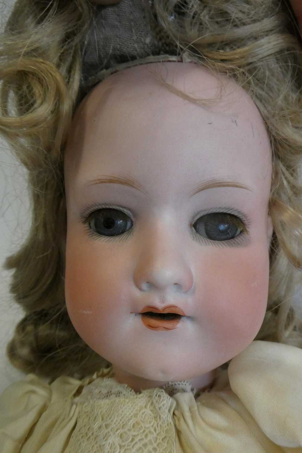 An Armand Marseille bisque socket head doll, with blue glass sleeping eyes, open mouth, teeth, blond - Image 2 of 3