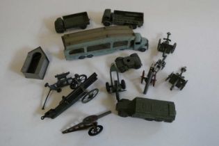 Playworn military vehicles by Dinky and others including filled guns and trucks, and a Dinky