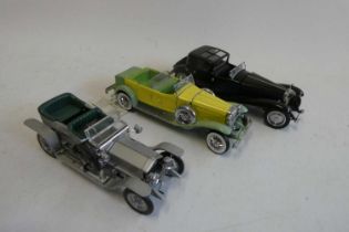 Three Franklin Mint 1/25th scale classic cars comprising Bugatti Type 41, Duesenberg Model J and