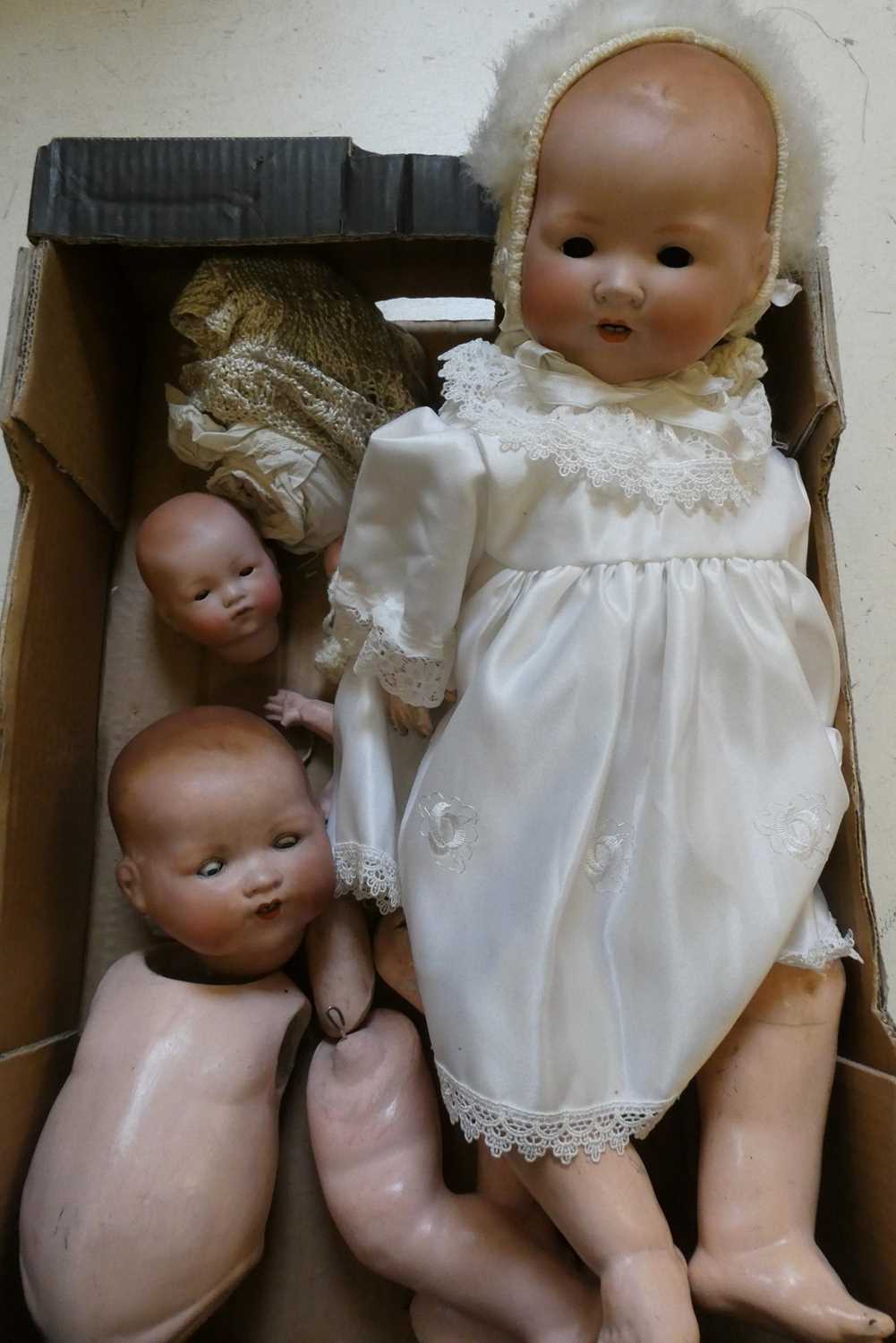 Three Armand Marseille dolls, comprising an 18" and 22" AM 351 and a 12 1/2" AM 341 Condition