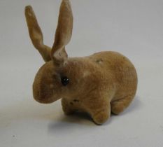 An early velvet rabbit, possibly Steiff, with shoe button eyes, 5" long Condition Report: