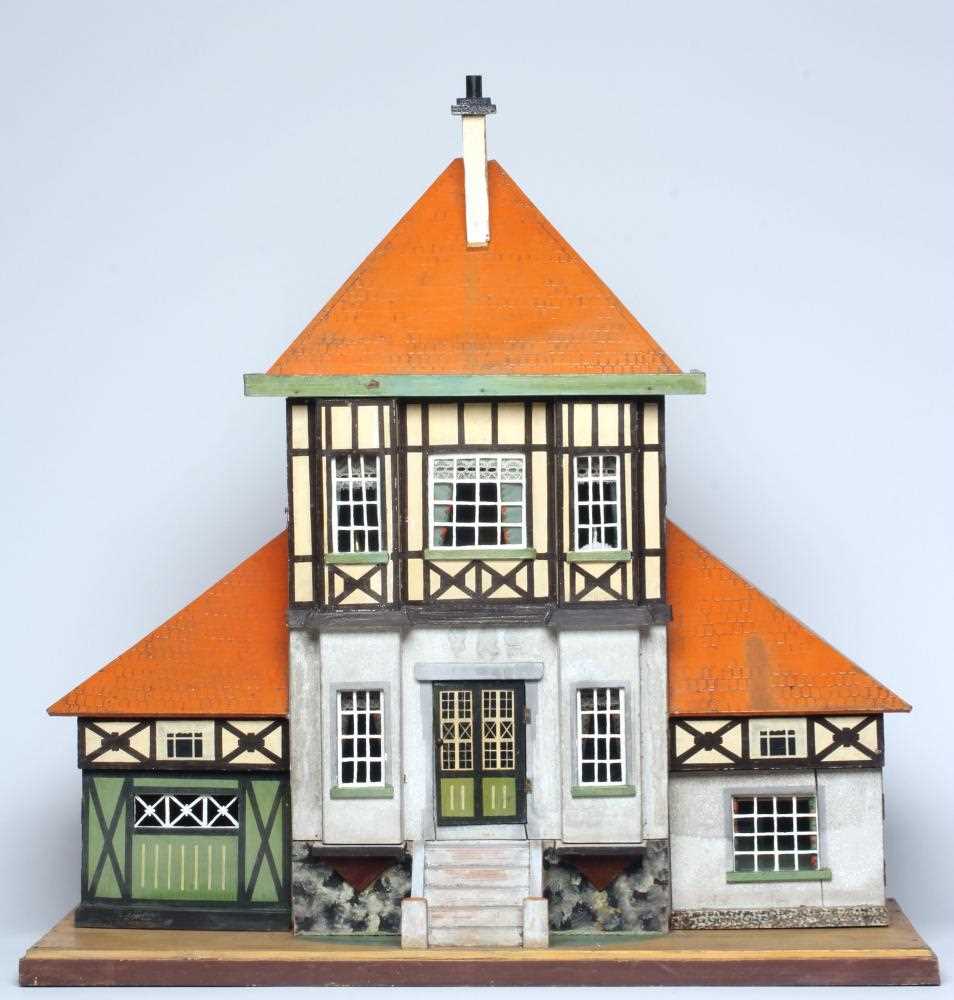 A Bavarian style German wooden dolls house, early/mid 20th century, 1/16th scale, with 2 split