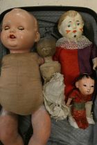 Four collectors dolls, comprising a part Victorian peg doll, a composition Japanese doll, a