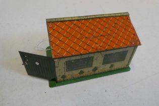 Meccano tinplate garage, tinplate printing faded, some scratches to garage roof, minor painting