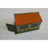 Meccano tinplate garage, tinplate printing faded, some scratches to garage roof, minor painting