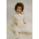 A Schoenau & Hoffmeister bisque socket head doll, brown glass sleeping eyes, open mouth, composition