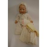 An Armand Marseille bisque socket head baby doll, with blue glass sleeping eyes, open mouth,