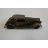 Minic clockwork hand painted camouflage saloon car, one front headlight missing, good