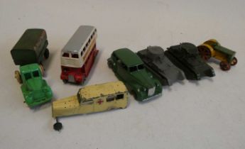 Pre-war Dinky tractor finished in green and yellow, two pre-war tanks, and three further Dinky