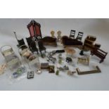 Box of antique dolls house furniture and accessories, including wood and metal examples Condition