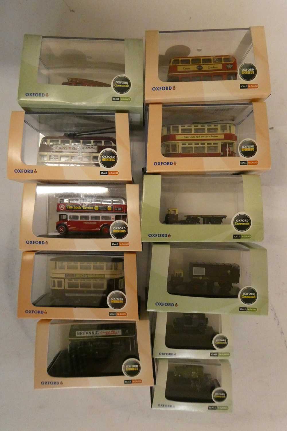 Eleven N scale Oxford Classic vehicles including buses, cars and wagons, all items boxed, mint