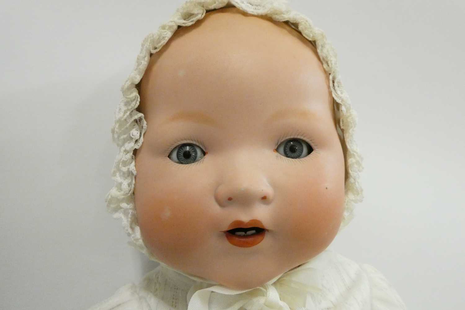 An Armand Marseille bisque socket head baby doll, with blue glass sleeping eyes, open mouth, - Image 2 of 3