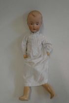 A Gebruder Heubach bisque socket head boy doll, with moulded eyes, moulded hair, closed mouth,
