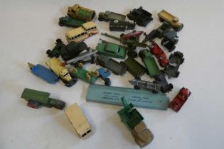 Unboxed diecast vehicles by various makers including Dinky, Crane Express Series and field guns,