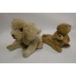 Two vintage automaton musical dogs, both with wind-up clockwork mechanism and heads that move with