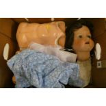 An Armand Marseille bisque socket head doll, with blue glass fixed eyes, open mouth, teeth,