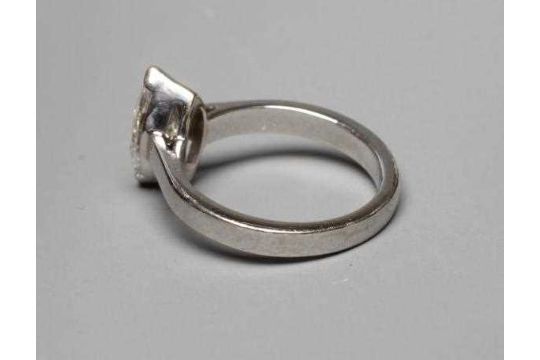 A SOLITAIRE DIAMOND RING, the marquise cut stone of 1.30cts claw set to a plain unmarked platinum - Image 4 of 7