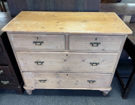 A pine chest of 2 short over 2 long drawers with brass drop drop handles. 95 w x 44 d x 82cm h.