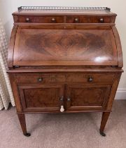 A 19thC cylinder topped writing table with inlays and white metal brass gallery and knobs. 74 w x 47