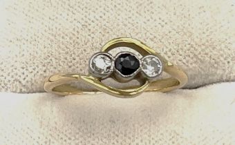 An unmarked yellow metal ring set with sapphire and two diamonds. Size H/I, weight 1.6gm.