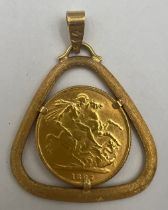 A Victorian 1887 full gold sovereign set in an 18 carat yellow gold mount on suspension ring.