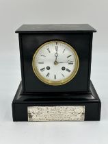 A black marble mantle clock with movement marked 'Japy Fils depos 1855 medailler 1844 1840' and