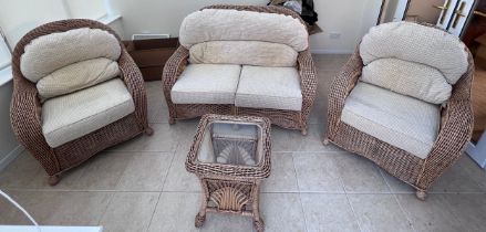 A three piece rattan conservatory suite together with a glass topped occasional table. Chair 101cm