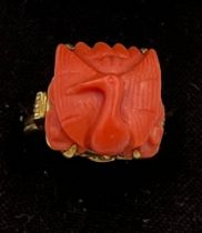 A Chinese 14 carat yellow gold ring set with carved coral bird. Size M, weight 6.1gm.