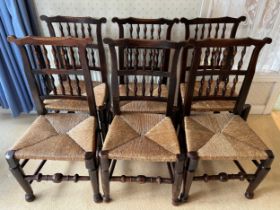 Set of six 18thC fruitwood dining chairs with spell backs and rush seats. 94cm high to back.