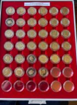 A collection of one pound proof coins from 1983. Taken from Royal Mint Annual Proof Sets. (34)