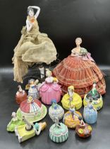 A quantity of half dolls, one made into a lamp, others with lidded pots, one marked France, one