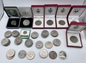 A collection of mostly crowns to include a 1921 United States of America One Dollar, a two pound DNA