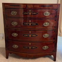 A 19thC mahogany inlaid bow fronted chest of four graduating drawers on bracket feet. 113cm h x 47cm