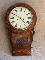 An American Wall Clock. 70 x 42cm. With pendulum and keys. Enamel face and Roman numerals.