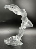 A boxed 20thC Lalique sculpture, modelled as a female nude, 'Arms Up Acrobat', standing on one leg