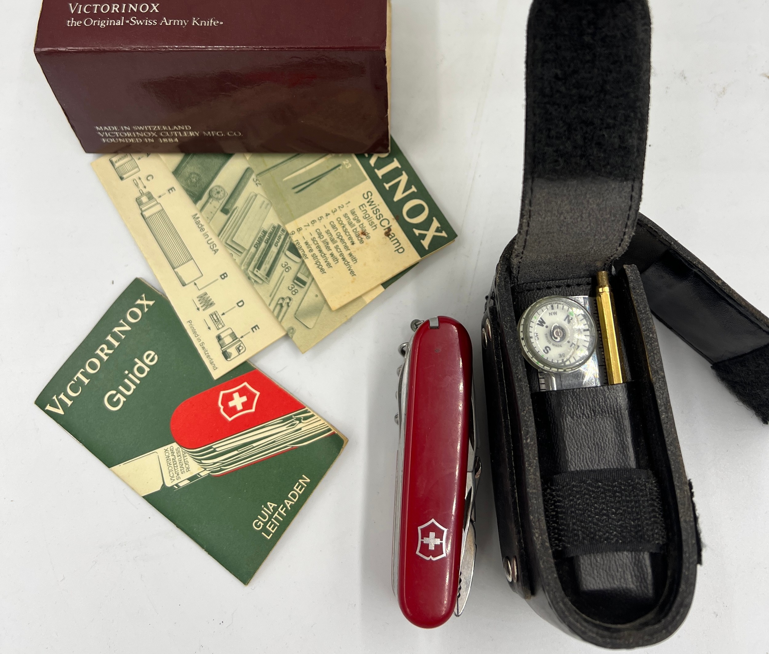 A Victorinox Swiss Army utility knife and accessories in fitted leather case and original box and