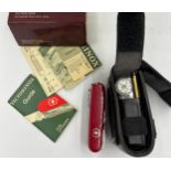 A Victorinox Swiss Army utility knife and accessories in fitted leather case and original box and