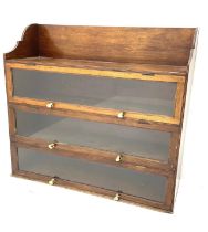 A 19thC mahogany bookcase with three hinged glass sections and shelf to top. 100 h x 107 w x 37cm d.